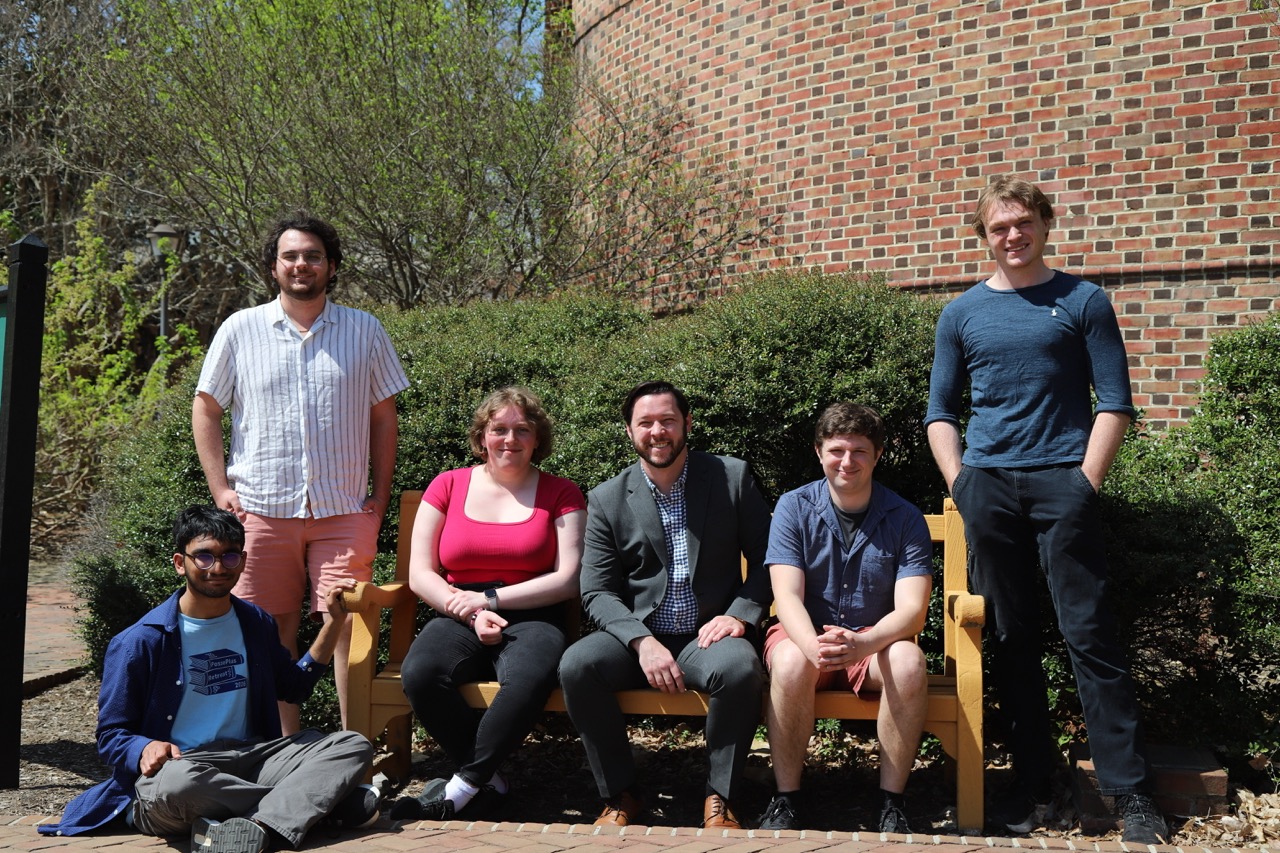 BQIS group members sitting outside on campus